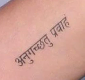 Katy Perry's Sanskrit tattoo, meaning "Go with the Flow"